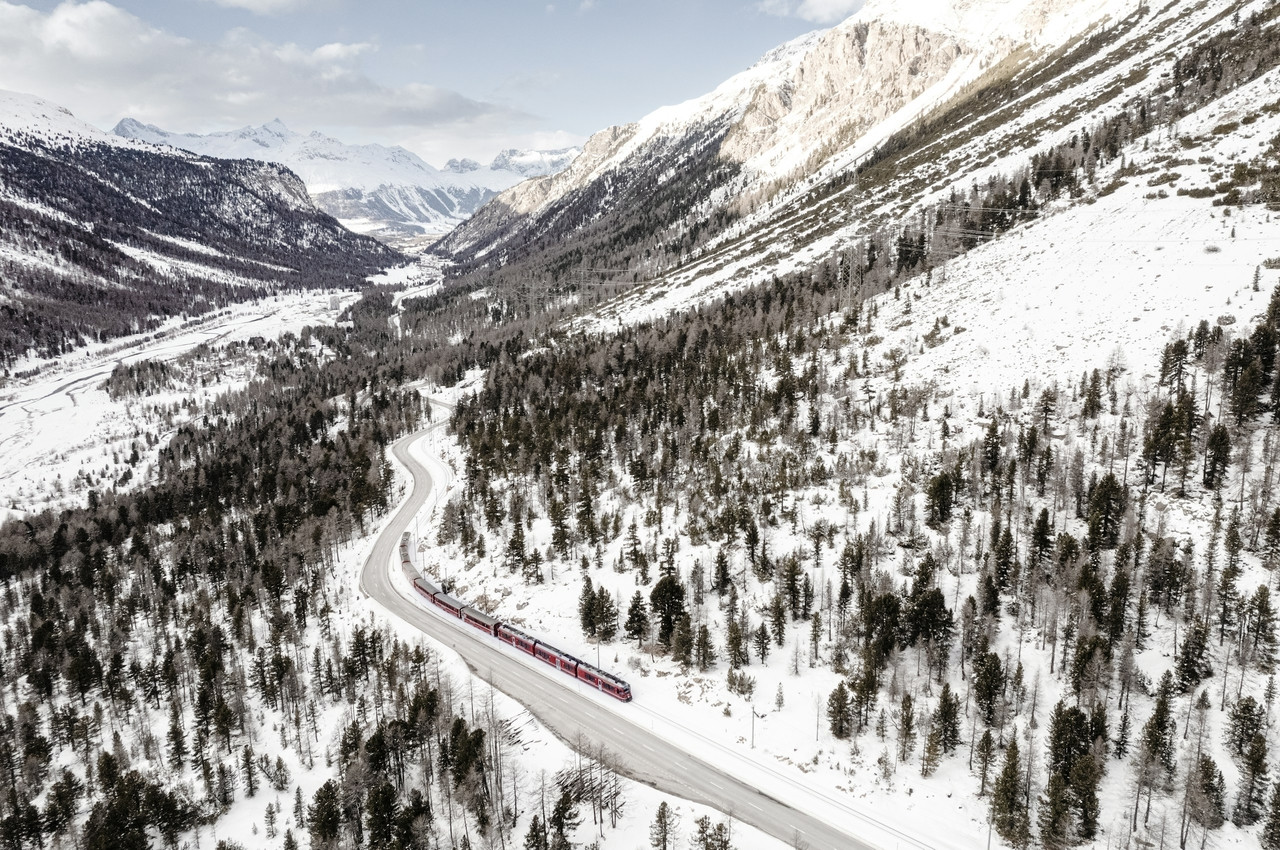 a train traveling through a snow covered forest, Ultra