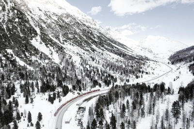 a train traveling through a snow covered mountain, Ultra