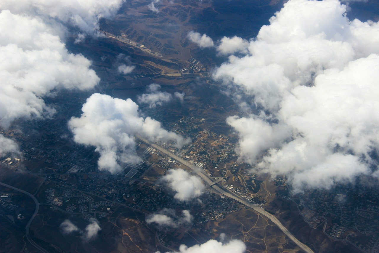 Aerial view of a town seen through clouds, Standard