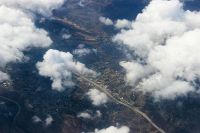 Aerial view of a town seen through clouds, Standard
