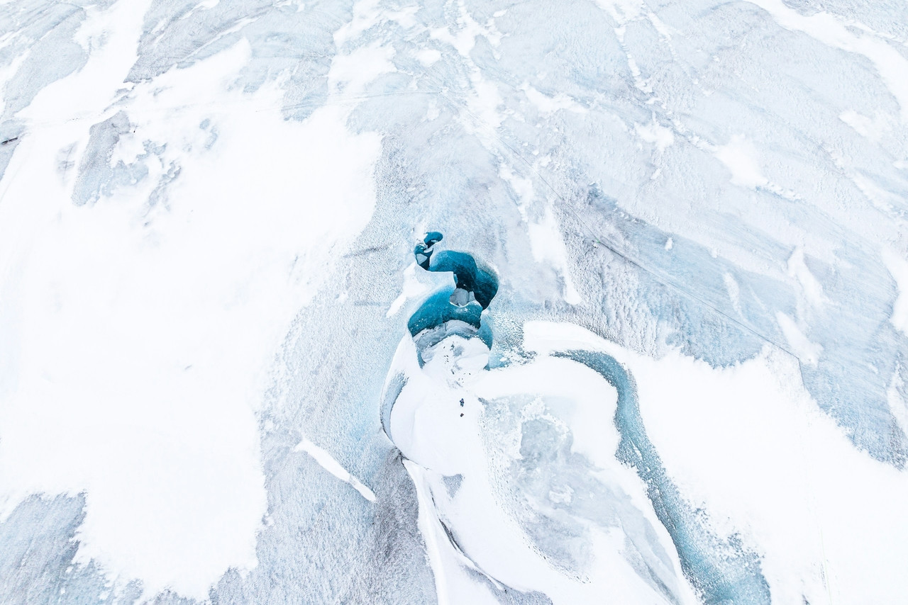 an aerial view of a snow covered mountain, Ultra