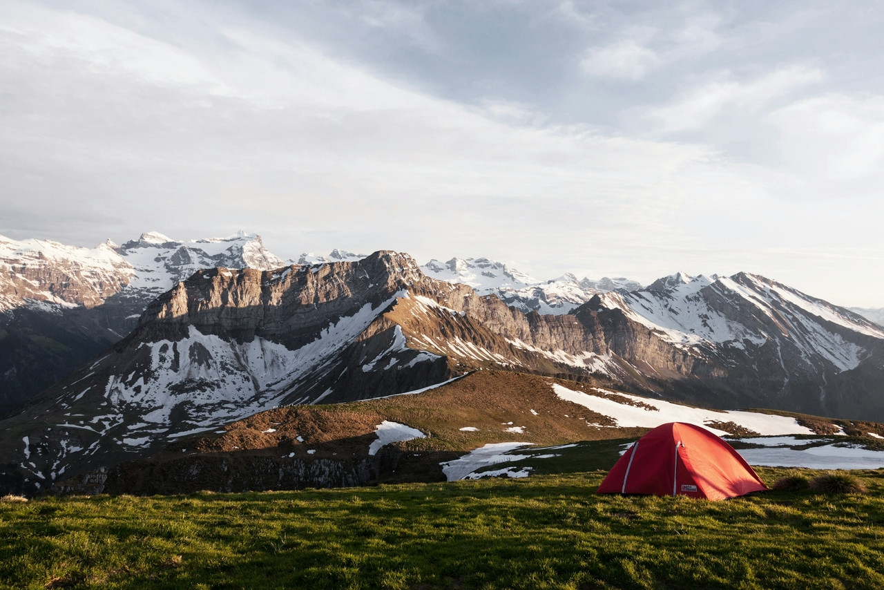 red tent on grass field beside ice capped mountain nature photography, Ultra